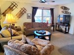 Enter into bottom floor rec room with sitting area, cable tv and DVD player